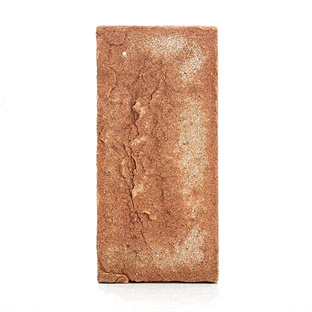 Single Cotswold clay brick paver standing upright and revolving to show texture and shape. Free UK delivery available.