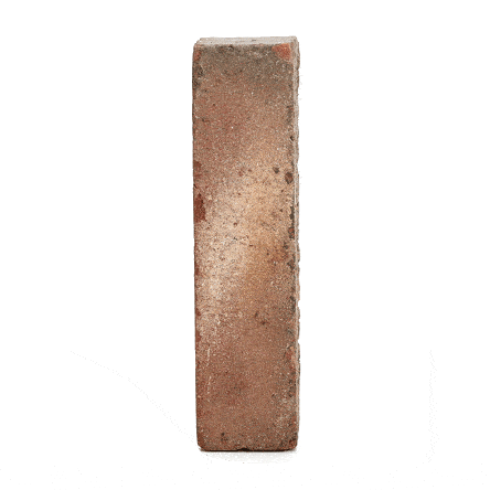Single dull red Bexhill clay brick paver standing upright and revolving to show texture. Free UK delivery available.