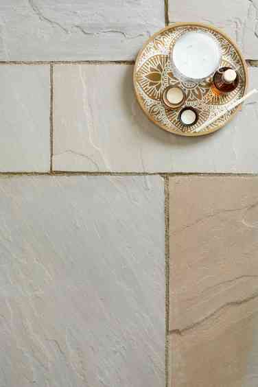 Indian sandstone paving with mortar joints and tray of refreshments