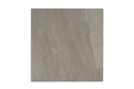 Single Kandla Grey porcelain paving slab, viewed from above, showing texture and markings including imitation riven surface.