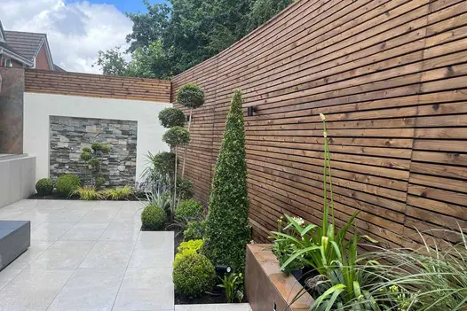 Full view of a structured garden layout using 900x450 pumice porcelain paving slabs.
