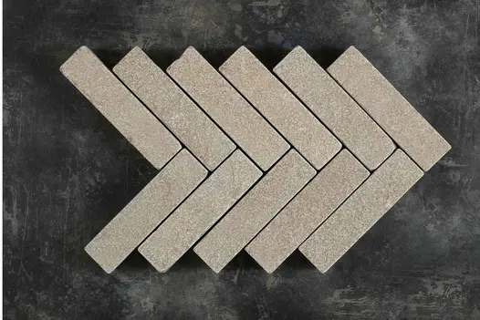 11 Antique Yellow stone pavers in limestone, arranged in a herringbone pattern with 6 courses of 2 bricks each. 