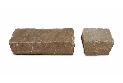 Two sizes of Autumn Brown Sandstone Setts on a white background highlight the riven texture and colour of these cobble setts.