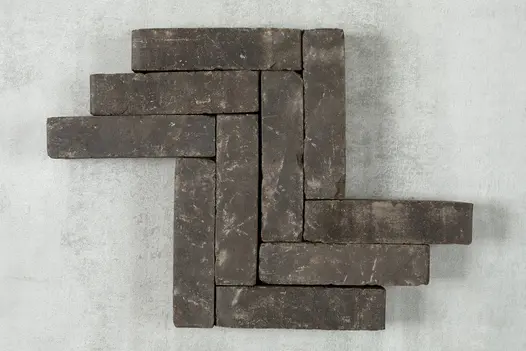 Z shaped pattern created by 10 charcoal grey clay paving bricks, showing off their dark colour with flecks of light.
