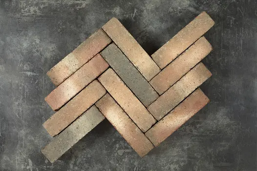 12 Bexhill clay pavers laid in herringbone pattern in 4 rows of 3 bricks, showing tones of red, buff and grey. 