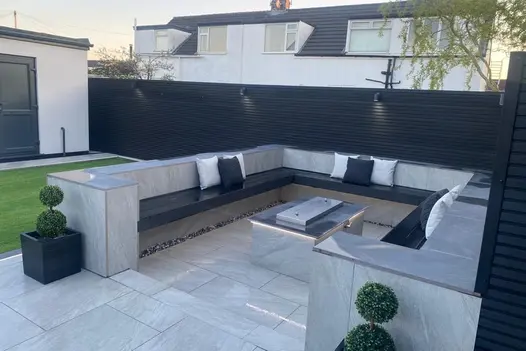 County Light 900x600 porcelain paving laid in a stylish outdoor space, complementing a modern landscape.