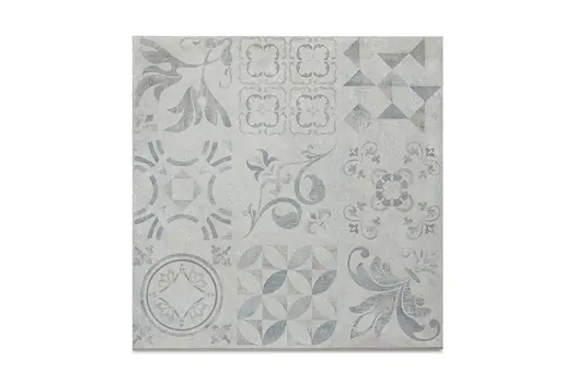 Close-up swatch of Deco 600x600 Porcelain Paving, featuring a patchwork of geometric and floral patterns in soft grey tones.