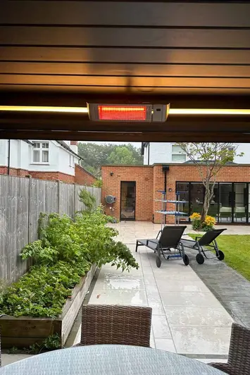 Deluxe Pergola with integrated heaters and LED lights, enhancing outdoor comfort in cooler weather.