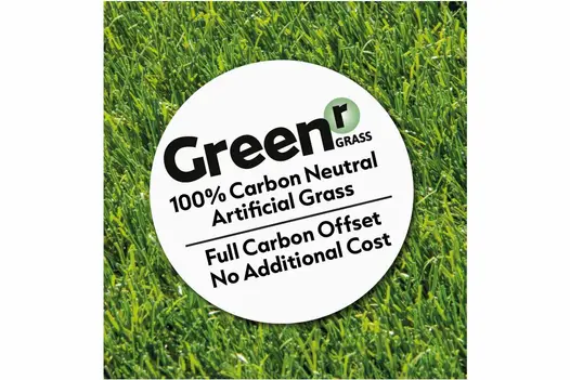 A label on a background of artificial grass, highlighting Greenr Grass as 100% carbon neutral for Rome Thick Artificial Grass.