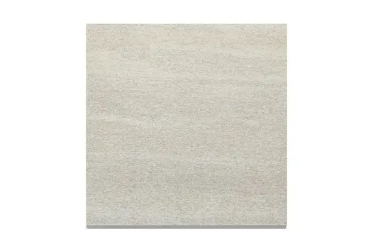 Close-up swatch of Overland Sand Porcelain, showing its soft beige colour and lightly textured finish.