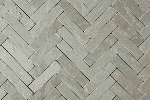 Detailed view of Tumbled Kandla Grey Sandstone Pavers, highlighting the intricate surface of the stone pavers and their use as patio bricks.