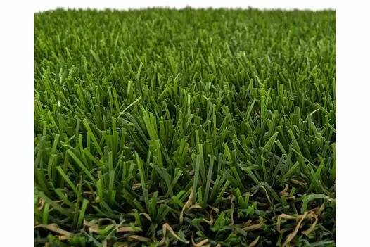 A detailed view of synthetic grass fibers, mimicking the texture of natural grass.