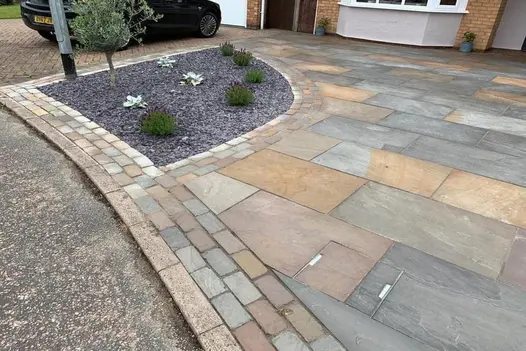 Detailed view of Raj Green Indian Sandstone 900x600 paving, showing unique colour variations and textured surface.