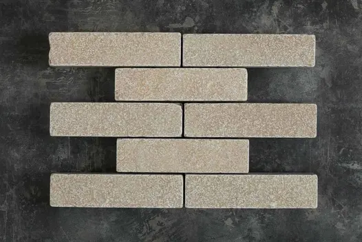 5 alternating rows of 1 and 2 Antique Yellow limestone patio bricks, showing texture and colour tones.
