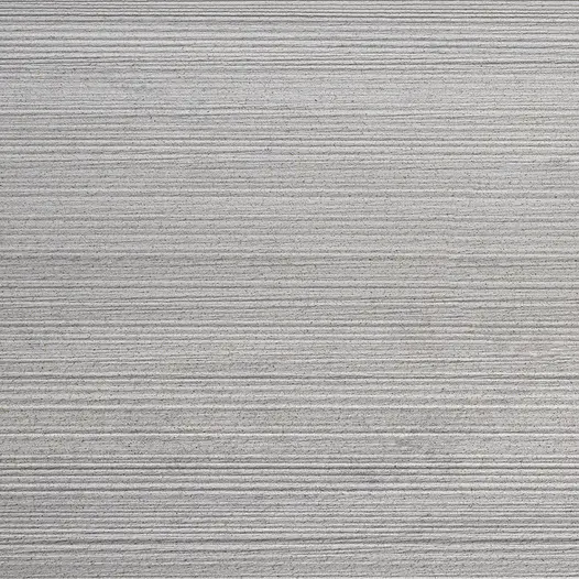 Close-up of square of Luna DesignBoard composite decking plank, showing tones and lined texture. Free UK delivery available.